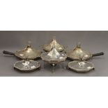 A set of six silver serving/warming dishes, together with two silver plated stands and burners.