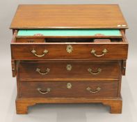 A Georgian mahogany dressing chest with fitted top drawer. 91 cm wide.