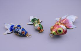 Three cloisonne fish. The largest 8.5 cm long.