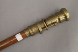 A walking stick, the handle set with a compass. 98.5 cm high.