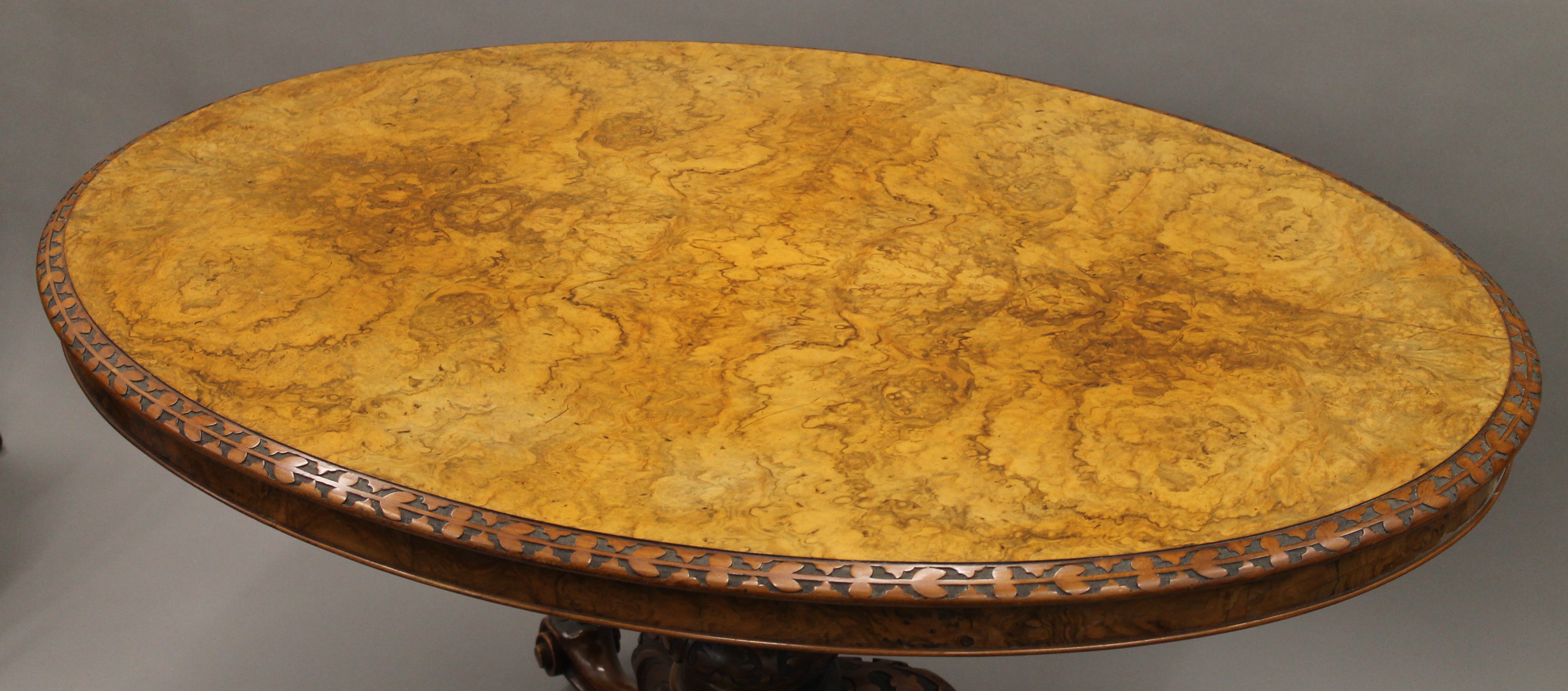 A burr walnut loo table with floral carved border. 122 cm long. - Image 3 of 6