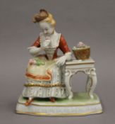 A German porcelain figurine, marked Unterweissbach 1882 to base. 14 cm high.