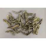 A quantity of Victorian brass stair rod clips.