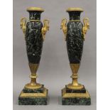 Two green marble vases with ormolu mounts. Each 39 cm high.