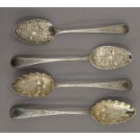 Two pairs of Georgian silver berry spoons (later embossed) . Each 22.5 cm long. 7 troy ounces.