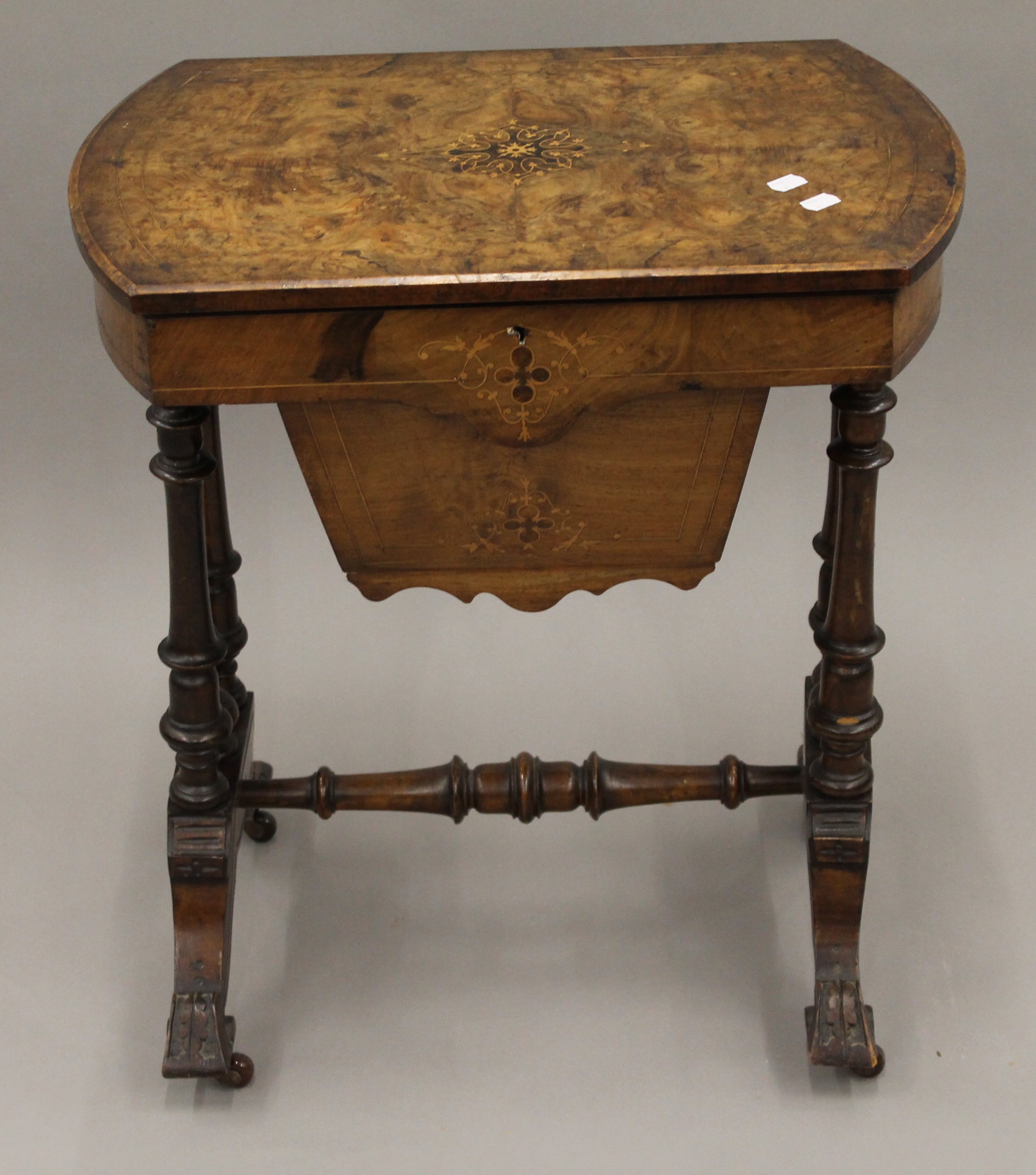 A Victorian inlaid burr walnut work table.