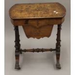 A Victorian inlaid burr walnut work table.