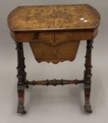 A Victorian inlaid burr walnut work table.
