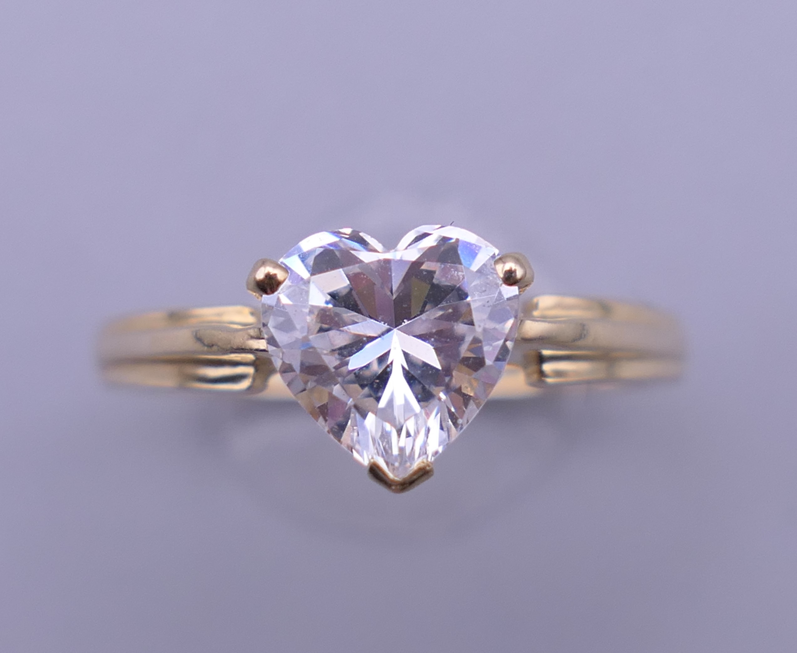 A 14 ct gold cubic zirconia ring. Ring size M. 2.3 grammes total weight.