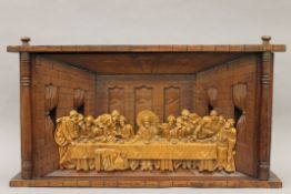 A wooden carving depicting The Last Supper. 81.5 cm wide.