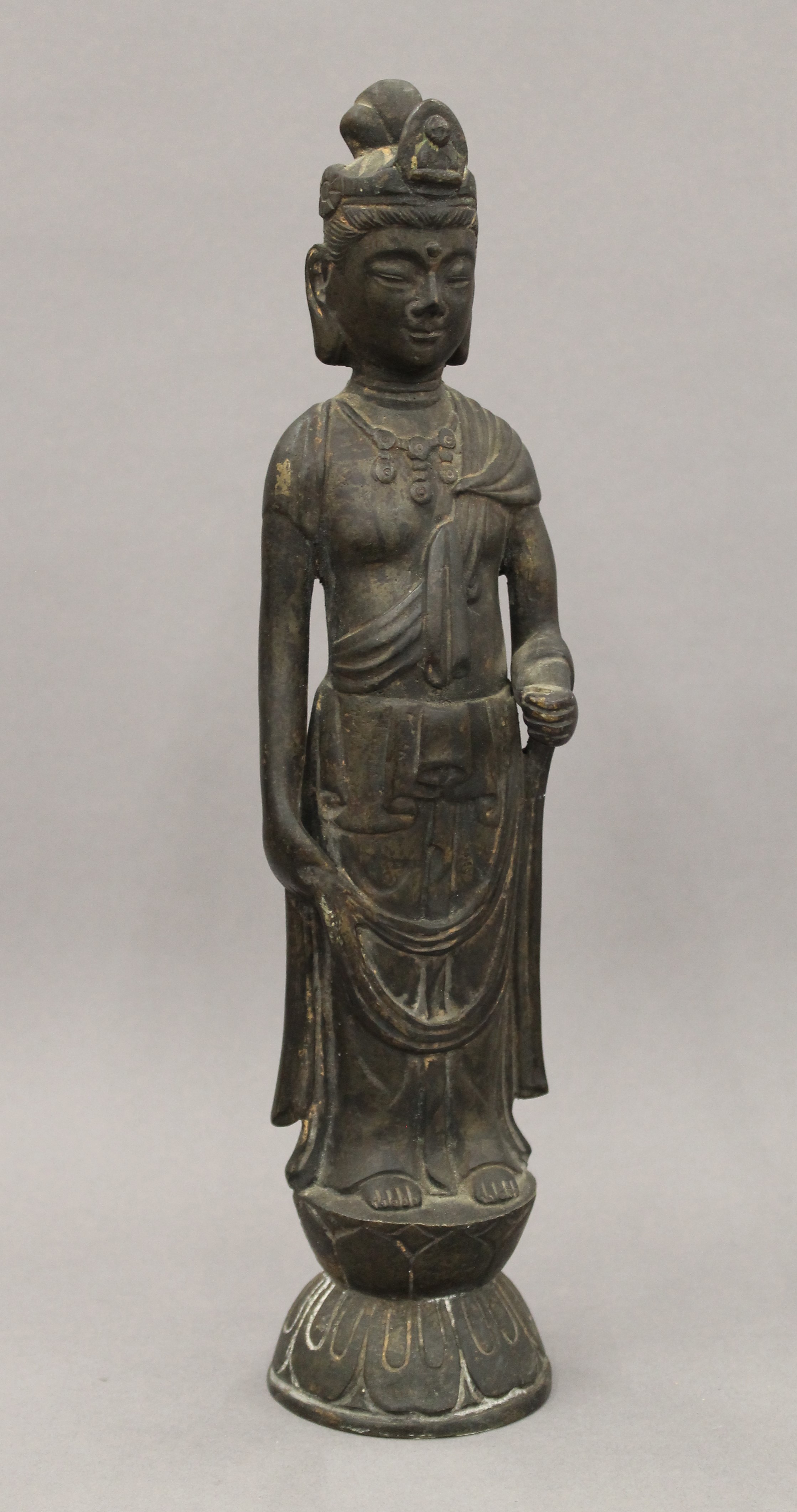 A pair of Chinese patinated bronze models of Guanyin. Each 32 cm high. - Image 2 of 13
