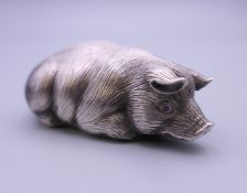 A silver model of a pig bearing Russian marks. 6.5 cm long.