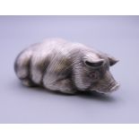 A silver model of a pig bearing Russian marks. 6.5 cm long.