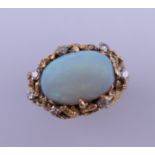 A vintage cabochon cut opal and diamond ring. The opal 4 carats. Ring size R. 10.