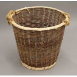A log basket. 63 cm high, the top 55 cm diameter.