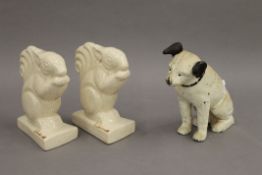 A cast iron money box formed as Nipper and a pair of French porcelain bookends formed as squirrels.