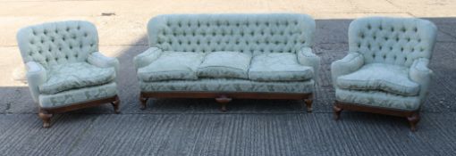 An early 20th century walnut framed upholstered three piece suite.