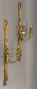 A pair of gilt brass twin branch wall lights. 64 cm high.
