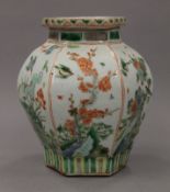 A small Chinese hexagonal famille verte porcelain vase. 16 cm high.