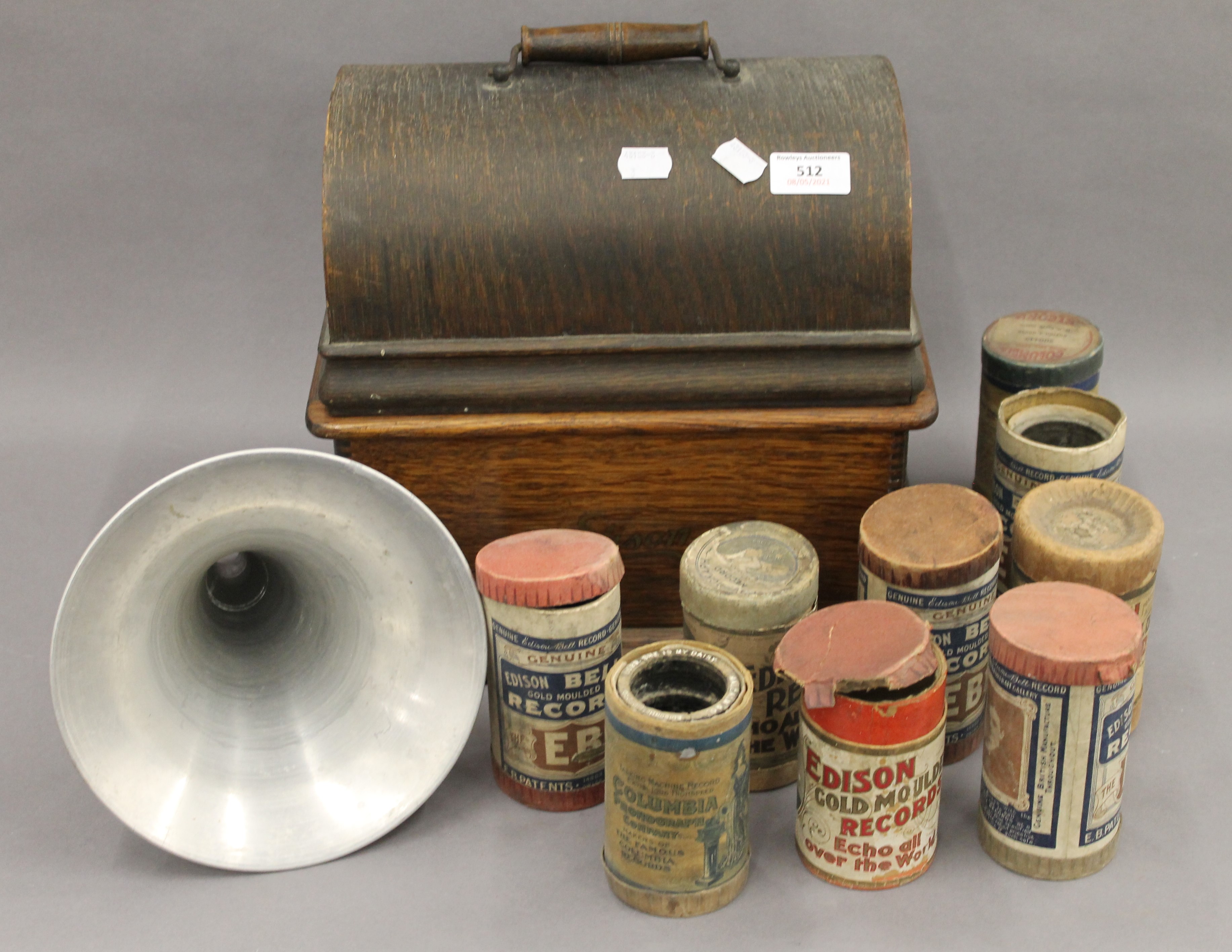 A Thomas A Edison oak cased phonograph with horn; together with a selection of phonograph rolls. 32.