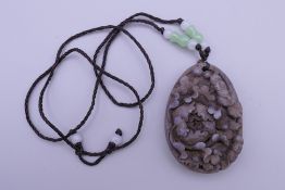 A carved pendant. 5.5 cm high.