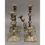 A pair of silver candlesticks and a pair of silver plated candlesticks. 30 cm high.