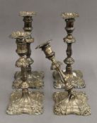 A pair of silver candlesticks and a pair of silver plated candlesticks. 30 cm high.