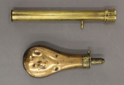 An antique copper powder flask and a brass telescope. The former 20 cm high.