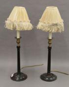 A pair of mahogany and brass table lamps. 60 cm high overall.