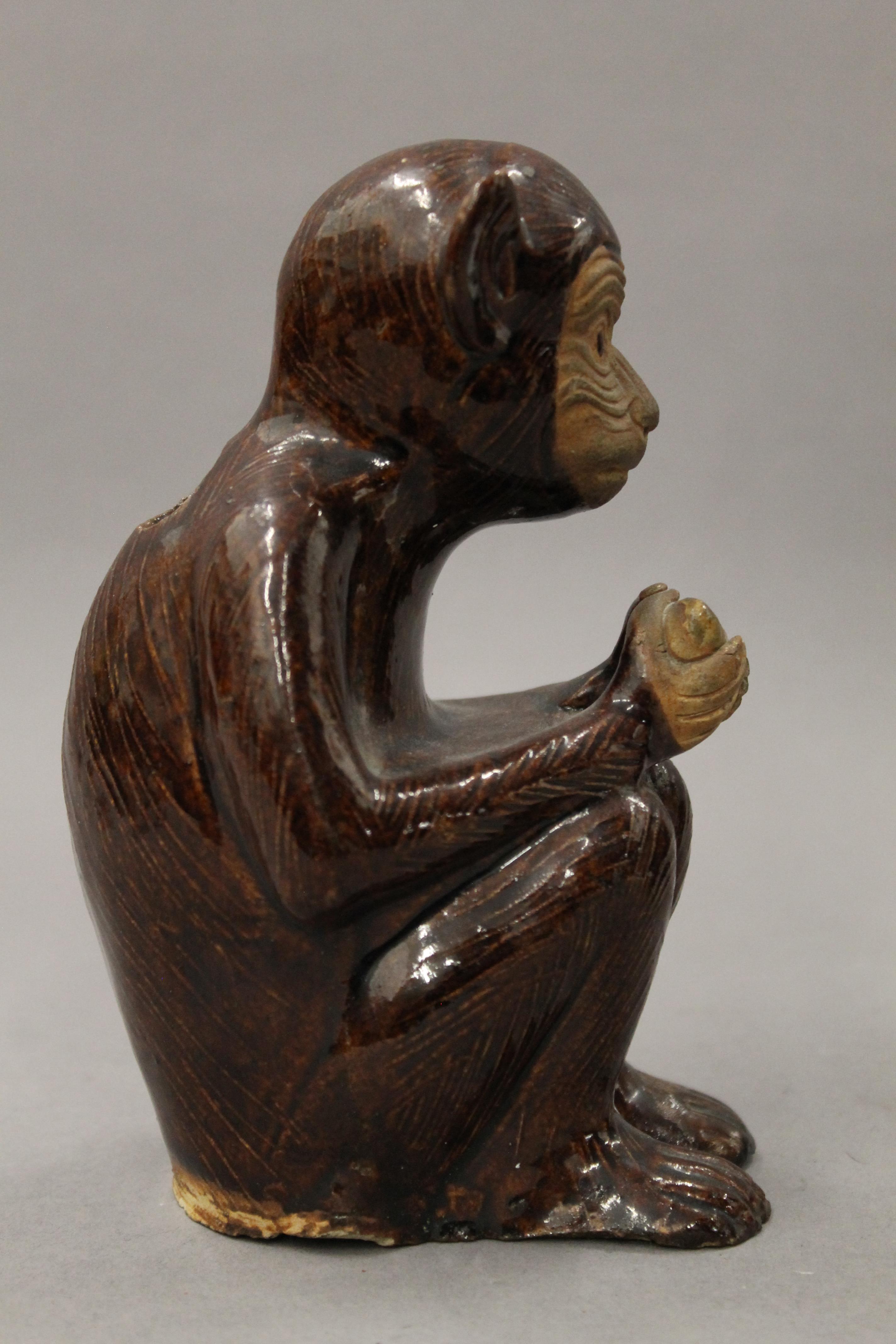 A pair of pottery censers formed as monkeys. Each 15 cm high. - Image 4 of 5