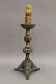 An enamel decorated bronze candlestick. 40.5 cm high overall.