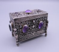 A Continental 800 silver box set with amethyst and agate cabochons. 5.5 cm high.