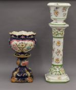 Two porcelain jardiniere's on stands. The largest 93 cm high overall.