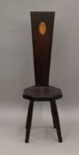 An inlaid mahogany spinners chair. 97 cm high.