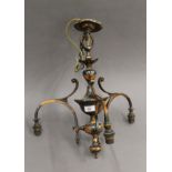 A copper chandelier with three glass shades. 45 cm high.