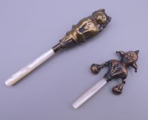 Two brass baby rattles. The largest 12 cm long.