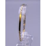 An 18 ct gold ID bracelet. 9 grammes. 20 cm long.