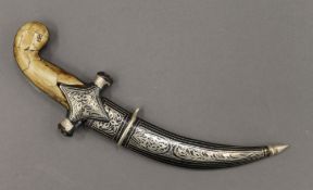 A bone handled dagger in scabbard. 24 cm long.