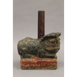 A 19th century Chinese painted carved stone dog-of-fo form incense holder. 15 cm long.