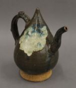 A Chinese pottery teapot. 14 cm high.