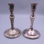A pair of Continental 830 silver candlesticks. 15 cm high. 12.9 troy ounces total weight.