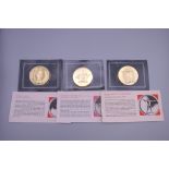 Three Franklin mint coins