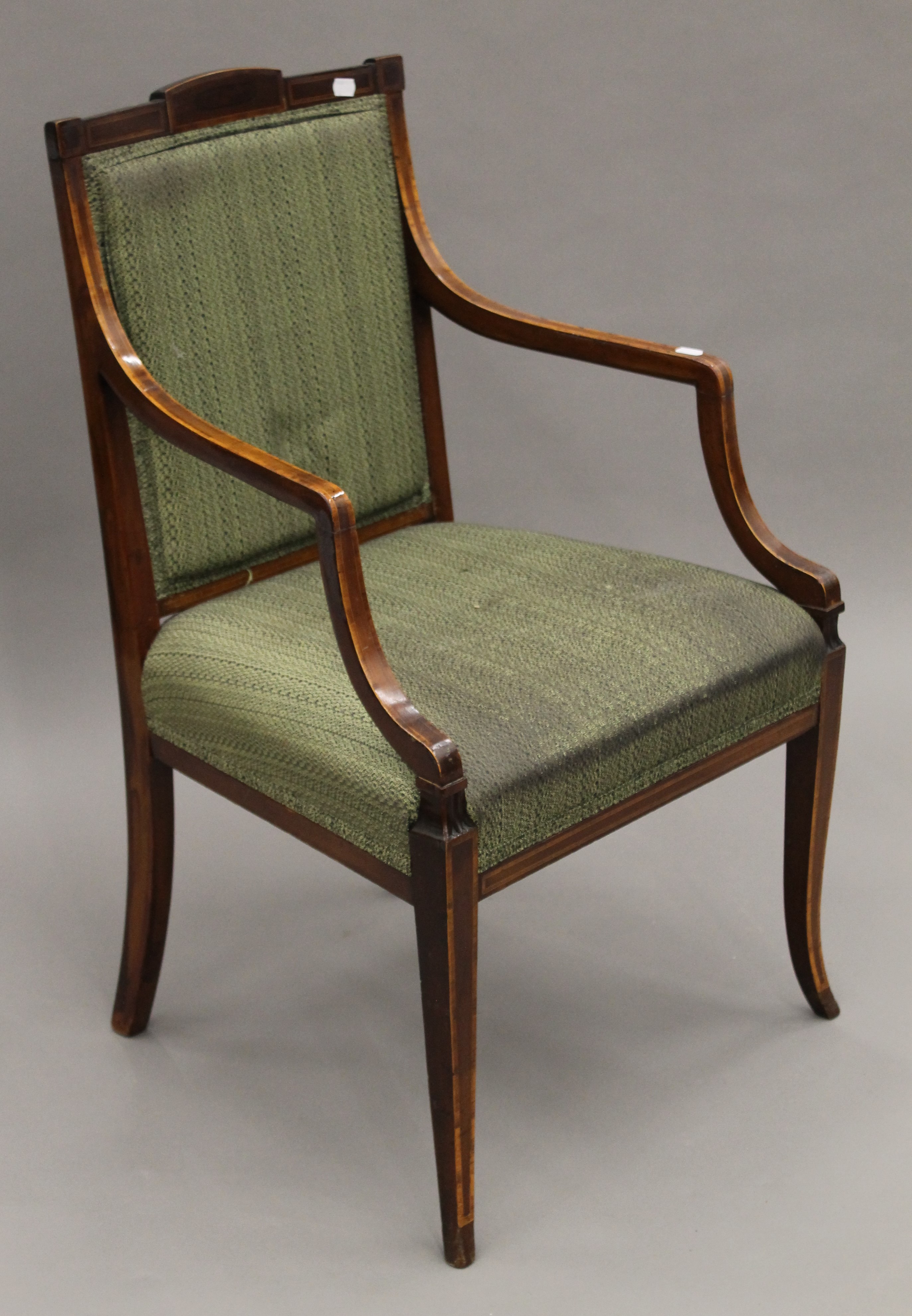 A Victorian upholstered mahogany open armchair. 56 cm wide.