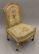 A 19th century tapestry covered nursing chair. 53 cm wide.