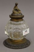 A Victorian bronze mounted glass inkwell. 16.5 cm high.