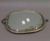 A Chinese silver plated mirror. 22.5 cm wide.