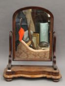 A Victorian mahogany toilet mirror. 61.5 cm wide.