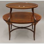 An Edwardian mahogany two-tier side table. 89.5 cm wide.