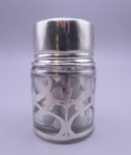 A silver overlay smelling salts bottle. 6.5 cm high.