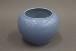 A Chinese light blue bulbous porcelain vase. 11 cm high.